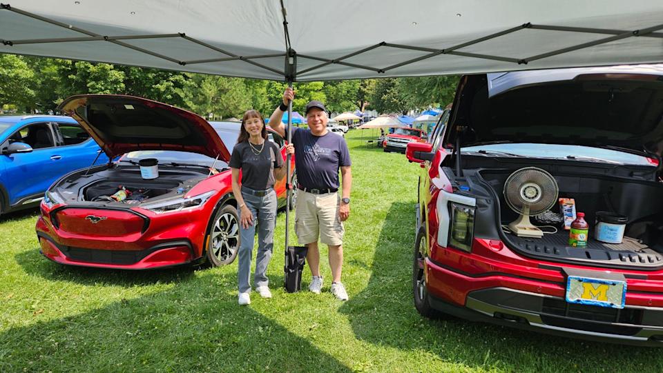 rhoda and rick eisenberg with mustang mach e and ford f150 lightning.jpg
