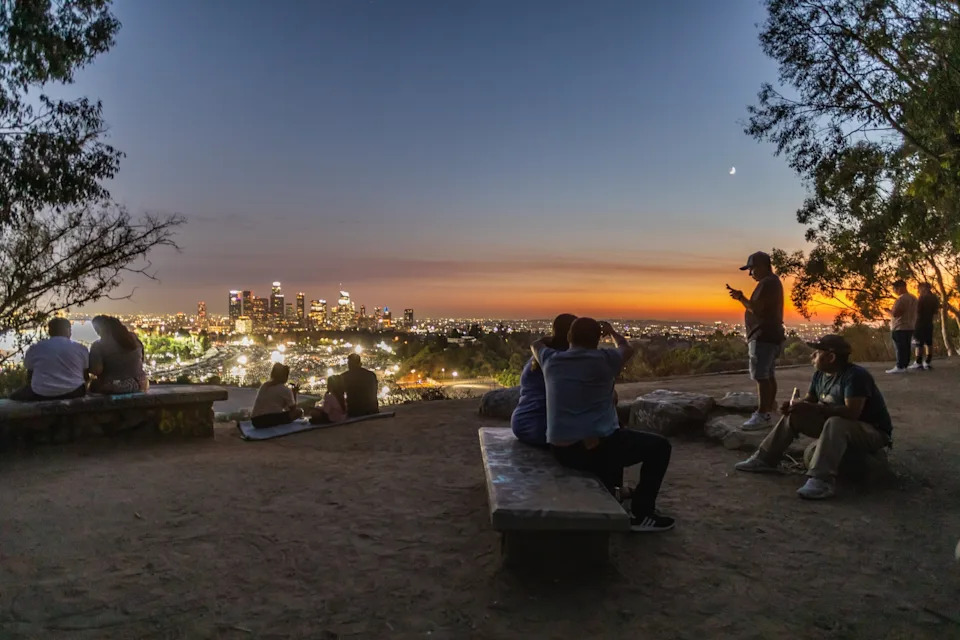 Apu Gomes/Getty Images - PHOTO: People hangout at Elysian Park at night due to high temperatures during the day, Sept. 6, 2024, in Los Angeles.