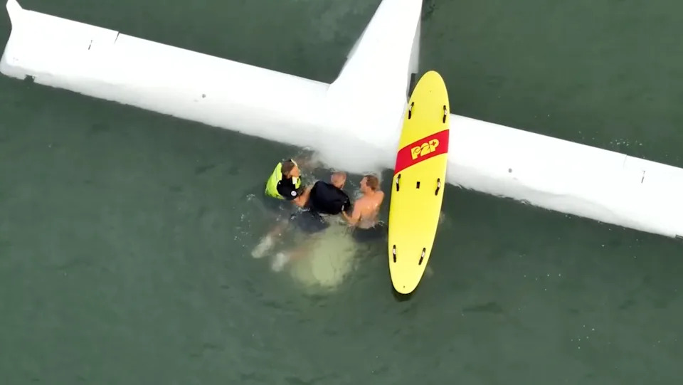 Rescuers pulling Finkelstein out of his plane.
