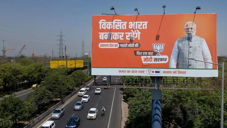 Prime Minister Narendra Modi<em> </em>appears on a Hindi-language billboard advertising the BJP in Noida, Uttar Pradesh, India, in April 2024. - Anindito Mukherjee/Getty Images