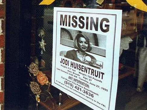Missing person poster for Jodi Huisentruit, detailing her disappearance on June 27, 1995, with contact information for leads