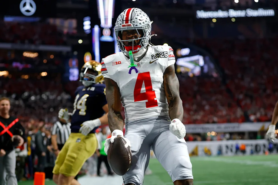 ATLANTA, GEORGIA - JANUARY 20: Jeremiah Smith #4 of the Ohio State Buckeyes reacts after scoring a touchdown during the second quarter against the Notre Dame Fighting Irish in the 2025 CFP National Championship at Mercedes-Benz Stadium on January 20, 2025 in Atlanta, Georgia. (Photo by Todd Kirkland/Getty Images)
