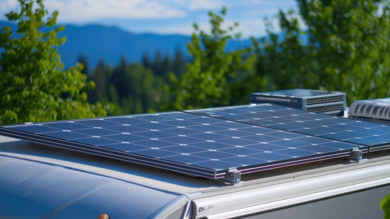 Two solar panels mounted on the roof of an RV