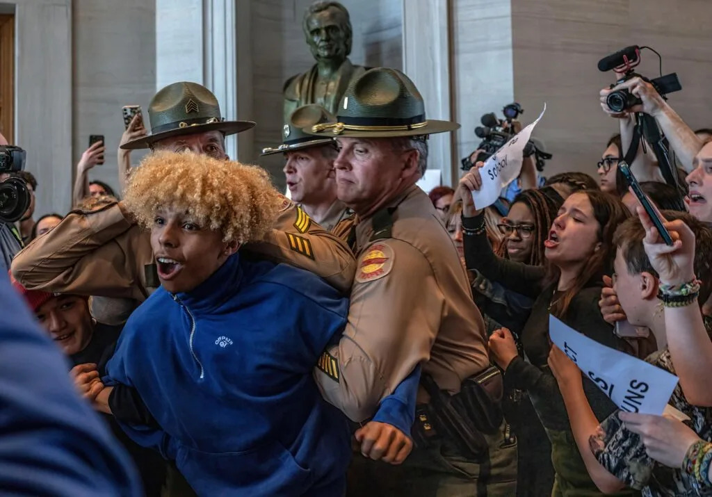 Tennessee Highway Patrol officers subdue a high school student during April 2023 protests over gun laws at the Tennessee Capitol. (Photo: John Partipilo/Tennessee Lookout)