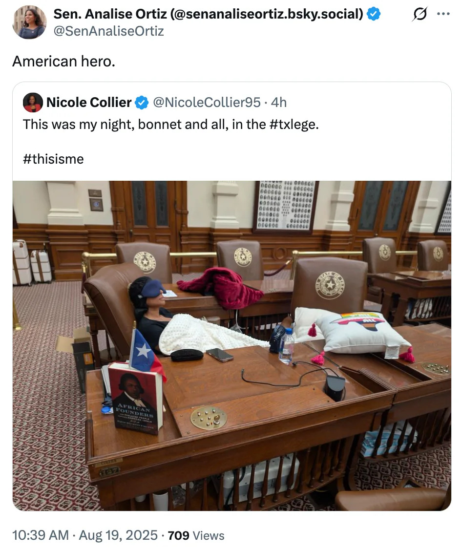Person resting with a bonnet at a government chamber desk, surrounded by books and personal items, highlighting a casual moment in a formal setting