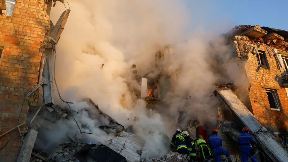 Rescuers race to reach victims as Russian strikes pound Kyiv, killing at least eight, including a child