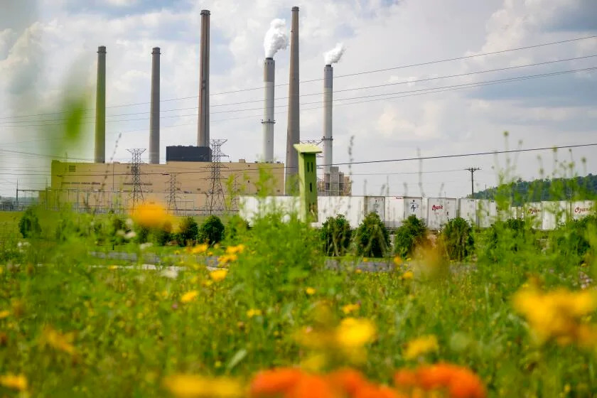 MAYSVILLE, KENTUCKY - JUNE 12: Smoke stacks from the Hugh L. Spurlock Generating Station are seen on June 12, 2025 in Maysville, Kentucky. The station is a 1.3-gigawatt coal power plant owned and operated by the East Kentucky Power Cooperative (EKPC) The Trump administration announced plans to repeal limits on greenhouse gas emissions and other airborne pollutants from the nation&#39;s fossil fuel-fired power plants. (Photo by Jeff Swensen/Getty Images)