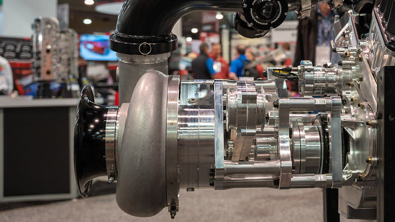 A Procharger Systems centrifugal supercharger attacked to an engine at an auto show