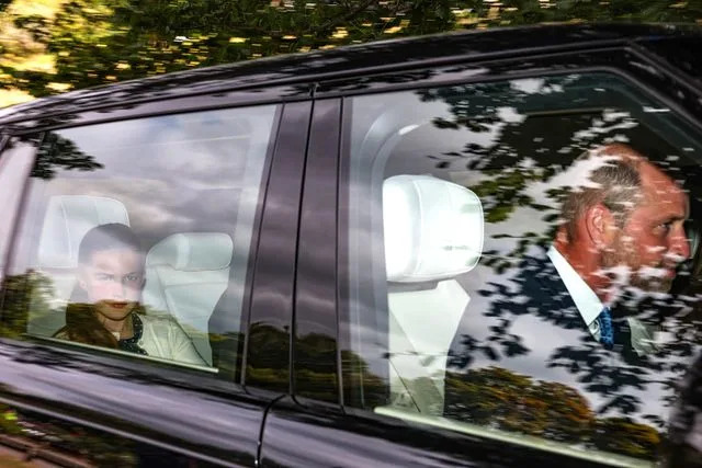 Jeff J Mitchell/Getty Princess Charlotte seen in the backseat as Prince William drove to a church service near Balmoral on Aug. 24.