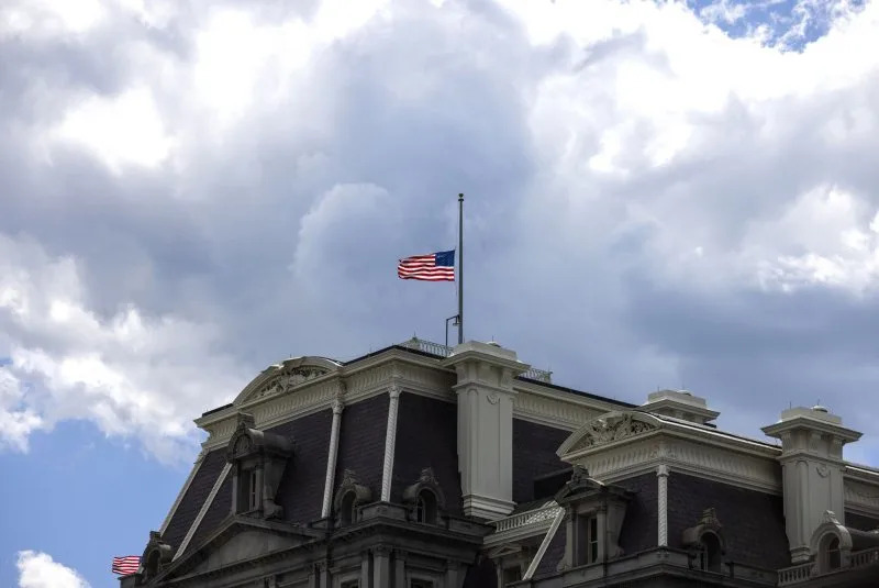 Flags are lowered to half-staff at the Eisenhower Executive Office Building in Washington, D.C., for the victims of a mass shooting at the Annunciation Catholic School in Minneapolis on Wednesday. Photo by Jim Lo Scalzo/UPI