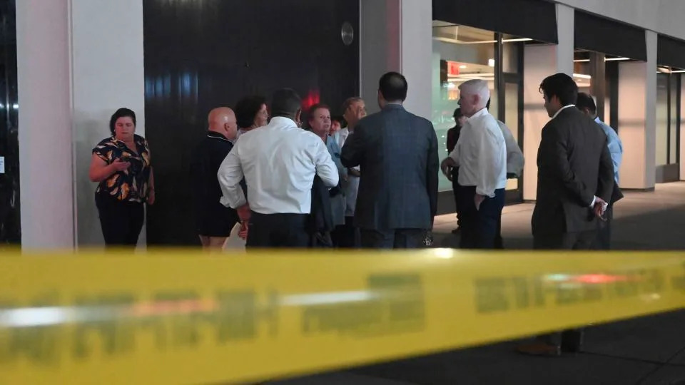 People exit the building to reunite with loved ones following a shooting at 345 Park Avenue in New York City on July 28. - Kyle Mazza/NURPHO/AP