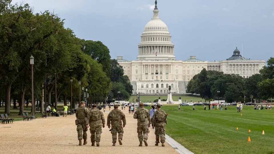 Members of the National Guard walk on the National Mall on August 14, 2025 in Washington, D.C. - Mehmet Eser/AFP/Getty Images