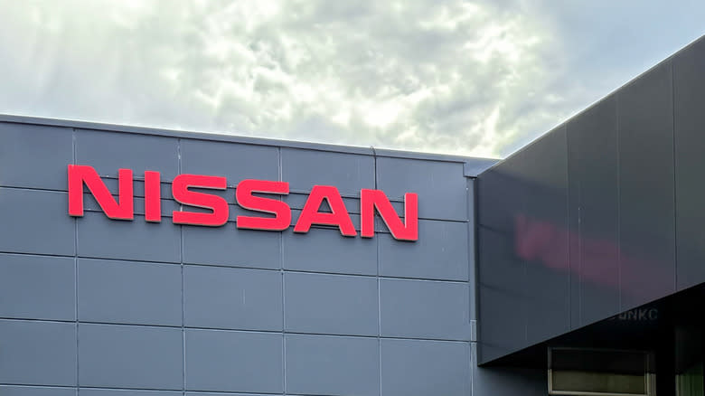 Facade of Nissan car store red letters. The frontage of the Nissan Car Showroom. The Nissan Motor Company is a Japanese automotive manufacturer. Japanese cars.