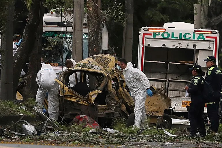 At least 18 killed in Colombia in drone attack on helicopter, car bombing