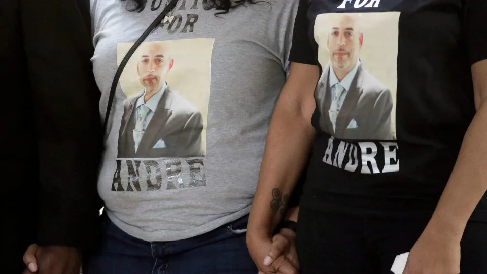 Andre Hill's sisters Michelle Hairston, left, and Shawna Barnett wear shirts with their brother's image while they appear at a news conference in Columbus, Ohio, the week after he was killed. - Barbara J. Perenic/Columbus Dispatch/USA Today Network/Imagn Images