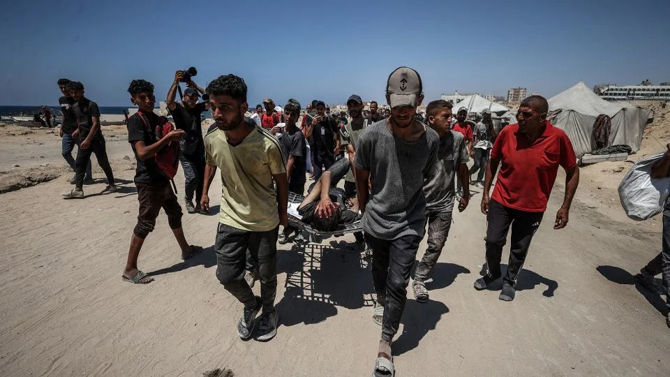 Injured Palestinians are transported to hospitals after Israeli forces open fire on civilians waiting for humanitarian aid in the Zikim area on Sunday. - Ali Jadallah/Anadolu/Getty Images