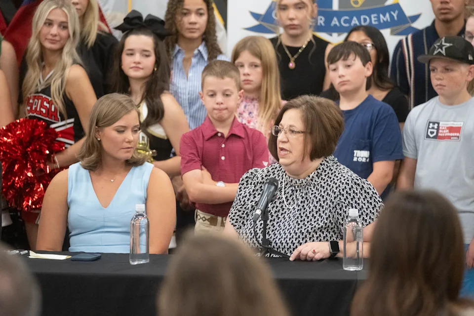 Amarillo High School teacher Mellessa Denny, right, shares her experience with phone restrictions in the classroom during a press event with Gov. Greg Abbott and Rep. Caroline Fairly at AmTech Career Academy in Amarillo on Aug. 1, 2025.