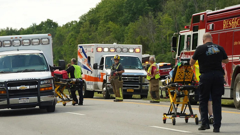 Rescue personnel work the scene of a tour bus that crashed and rolled over on the New York State Thruway near Pembroke, N.Y., Friday, Aug. 22, 2025.