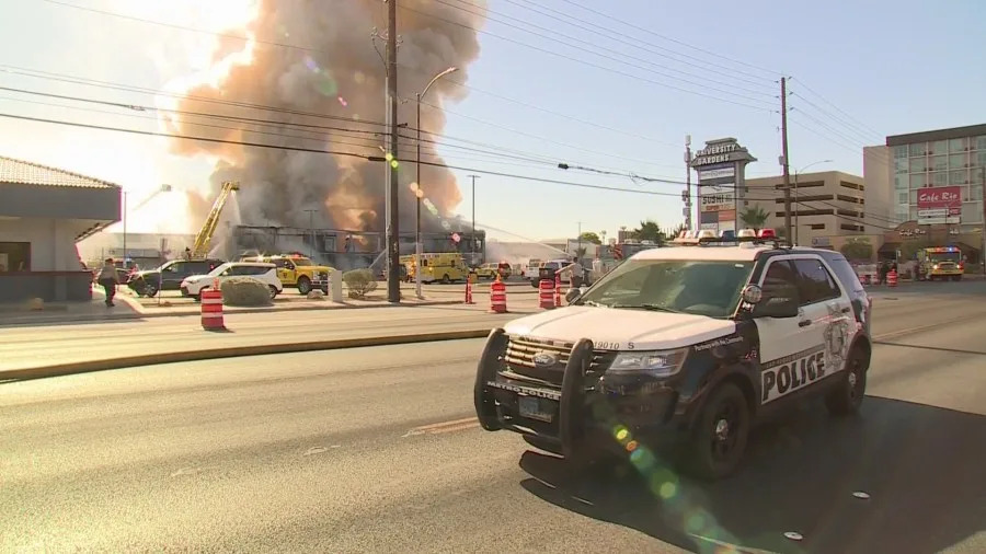 Clark County fire crews battle a large blaze at a business complex across the street from the UNLV campus on Maryland Parkway, near Tropicana Avenue on July 25, 2025. (KLAS)