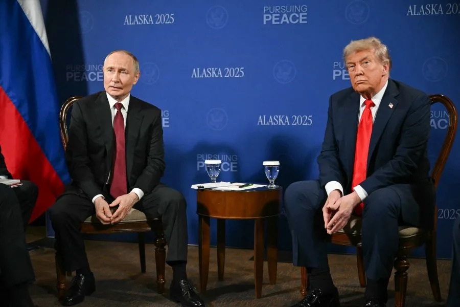 US President Donald Trump and Russian President Vladimir Putin meet during a US-Russia summit on Ukraine at Joint Base Elmendorf-Richardson in Anchorage, Alaska, on August 15, 2025. US President Donald Trump and his Russian counterpart Vladimir Putin shook hands and exchanged greetings Friday as they arrived at a military base in Alaska for a historic summit on Moscow’s war in Ukraine. (Photo by ANDREW CABALLERO-REYNOLDS / AFP) (Photo by ANDREW CABALLERO-REYNOLDS/AFP via Getty Images)