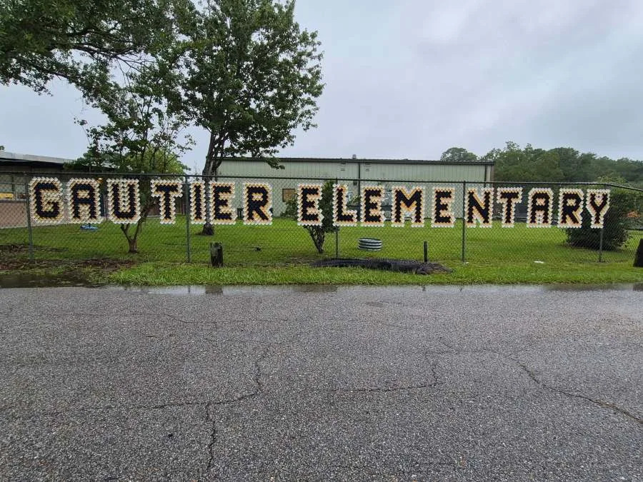 According to Gautier Elementary School officials, an alligator was spotted outside the school building on August 5. (Courtesy: Gautier Elementary School)