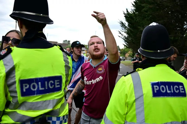 UK vows to speed up asylum claims as hotel protests spread