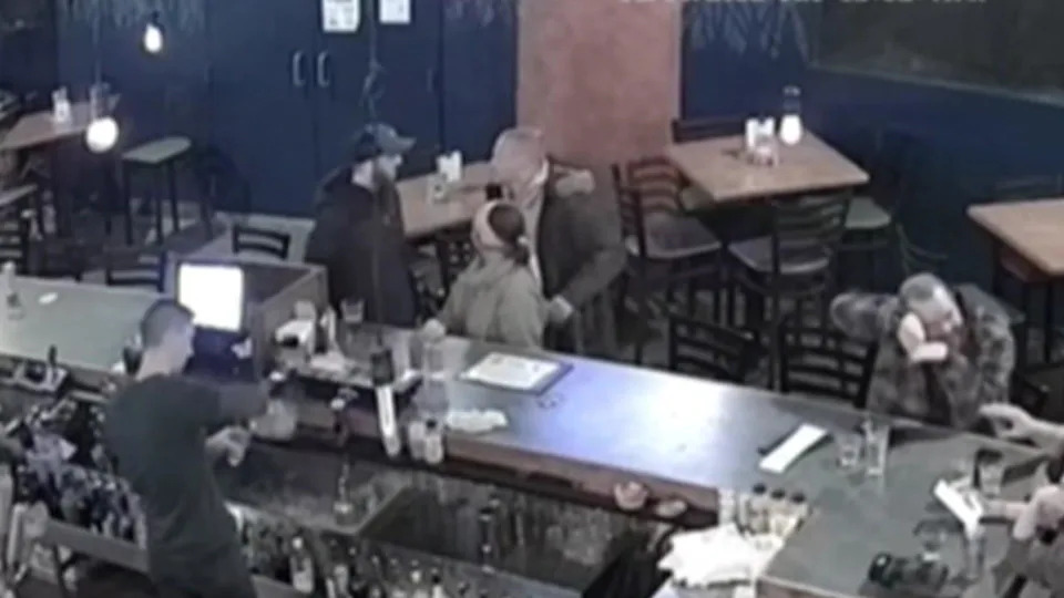 From left, security video shows Shane Anderson, Matthew Ecker and Alex Pennig seen talking at Camp Bar on Dec. 16, 2022, just before an altercation between the two men. / Credit: Ramsey County District Court