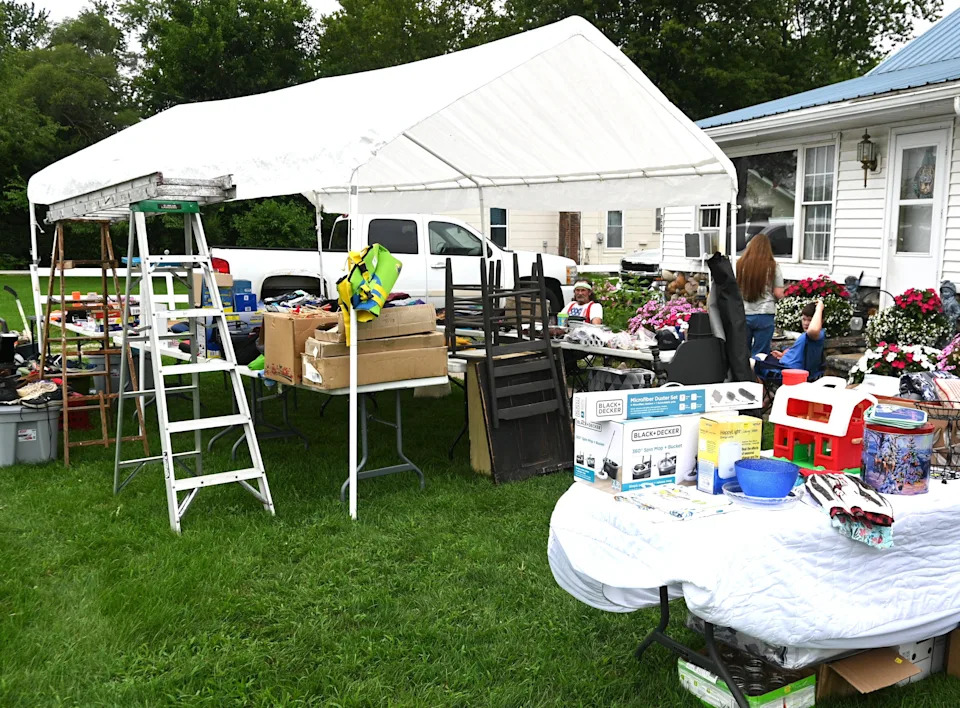 Some people set up Thursday ready for early sales like at this home in Bronson last year.