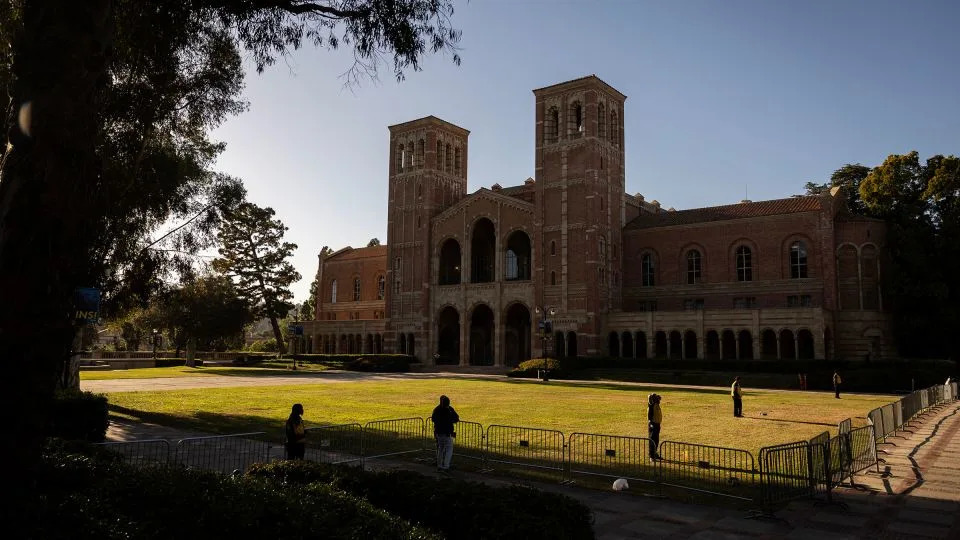 Security officers stand guard on the lawn in front of UCLA&#39;s Royce Hall on May 6, 2024, the week after a Pro-Palestinian encampment was dismantled. - Eitienne Laurent/AFP/Getty Images/File