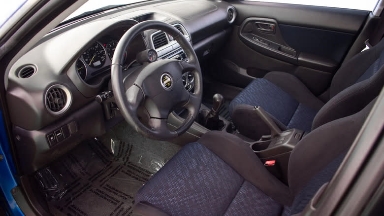 a look through the driver's door into the immaculate interior of a 2003 Subaru Impreza WRX