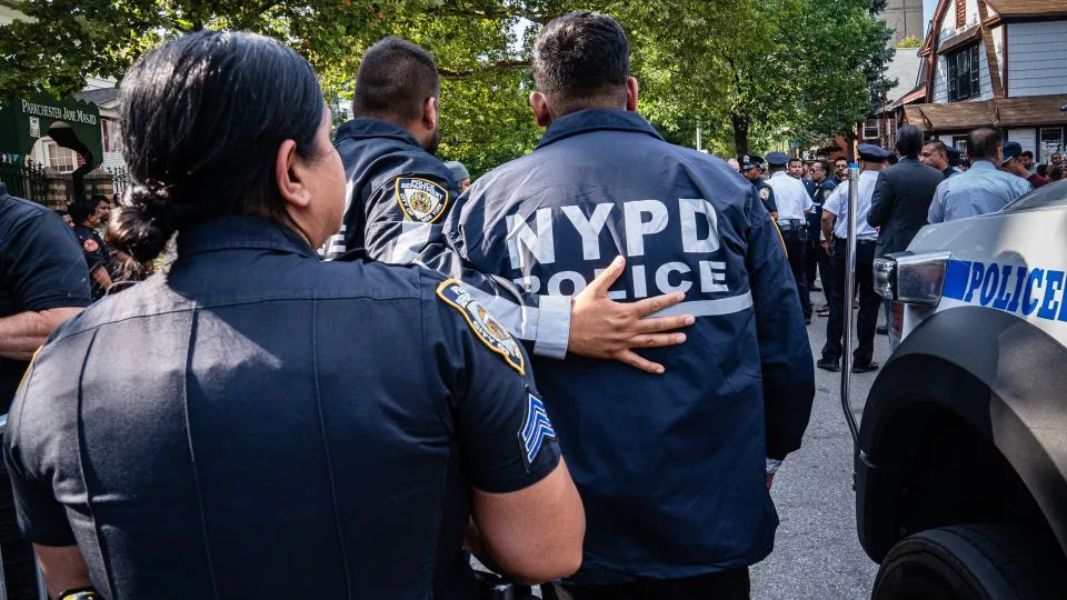 Police officers gather to show their support for Islam. - Timothy Fadek for CNN