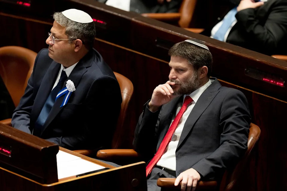FILE -Far-right Israeli lawmakers Itamar Ben Gvir, center, and Bezalel Smotrich, right, attend the swearing-in ceremony for Israel's parliament, at the Knesset, in Jerusalem, Nov. 15, 2022 (Copyright 2022 The Associated Press. All rights reserved.)