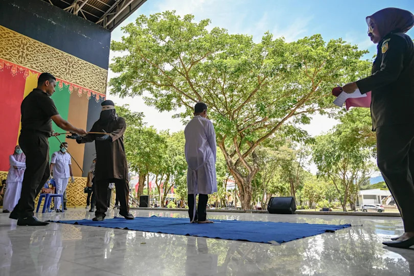 2 men publicly caned for hugging and kissing in Indonesia