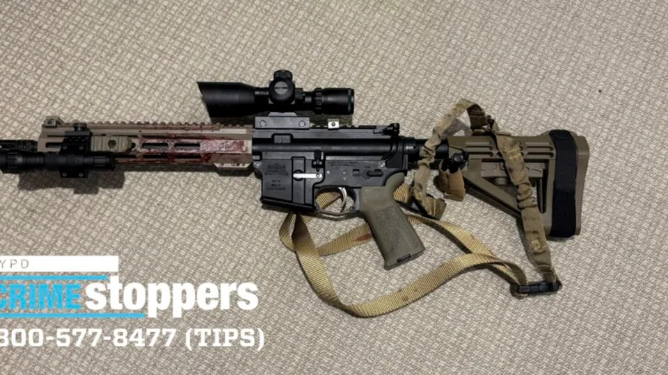 This photo provided by the New York Police Department shows a rifle used in a shooting that killed four people at a Manhattan office building on July 28. - New York Police Department/AP