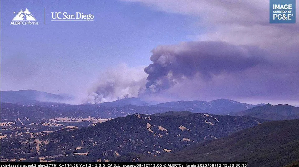 The Gifford Fire sends up a dark column of smoke in a view from Tassajara Peak while burning in San Luis Obispo County’s Garcia Wilderness on Aug. 12, 2025.