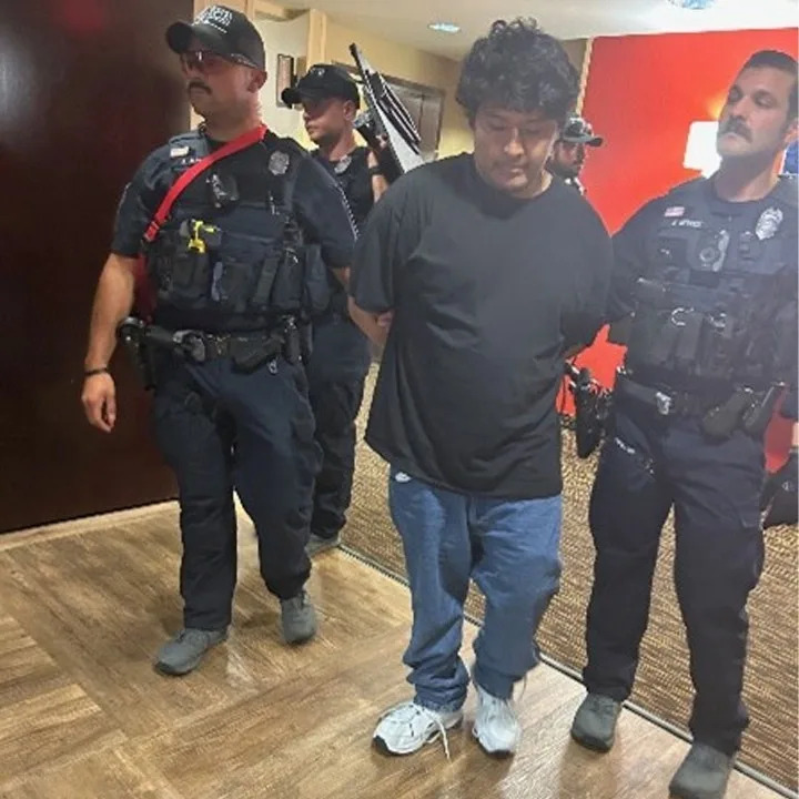 26-year-old Andres Caceres Jaldin being arrested by police