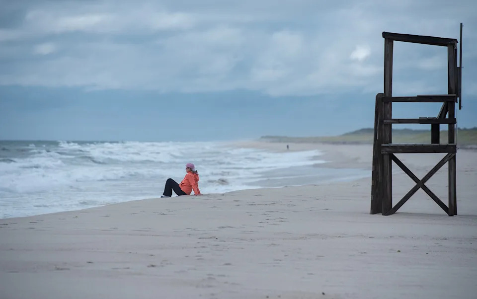 Kathy Dwyer had an early morning perch all to herself at Nauset Beach in Orleans to take in the spectacle of surf whipped up by Hurricane Erin, far to the south of Cape Cod.
Photo taken on August 21, 2025