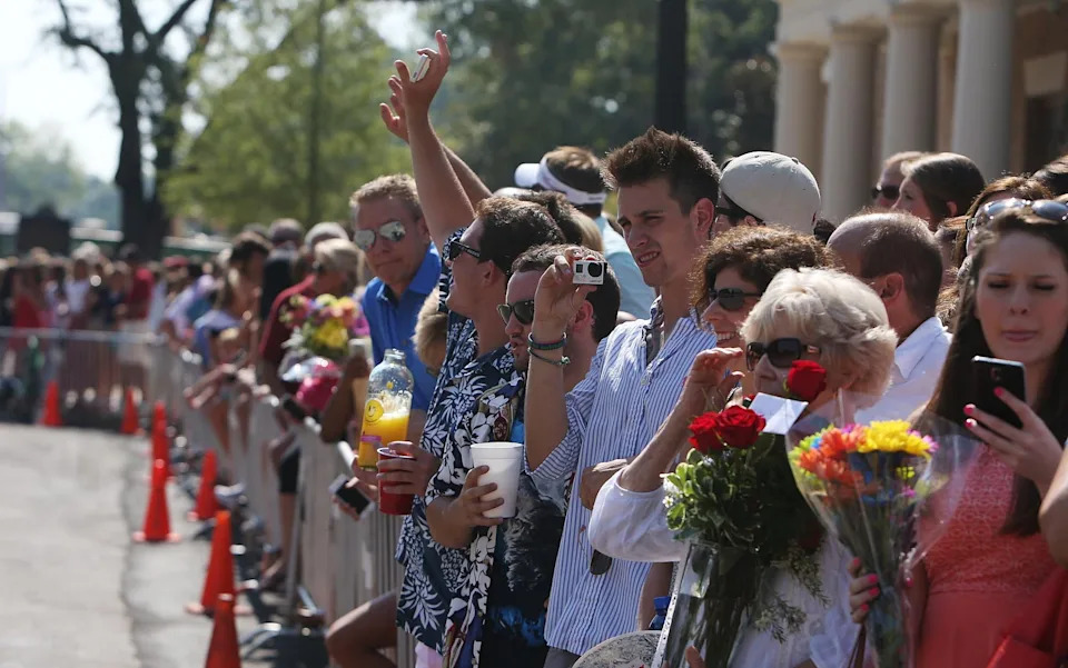 Family and friends wait for girls run to their prospective sorority houses after opening their bids in Bryant-Denny Stadium in Tuscaloosa, Ala. on Saturday Aug. 16, 2014. Approximately 2,300 girls participated in the University of Alabama's fall recruitment.  staff photo | Erin Nelson