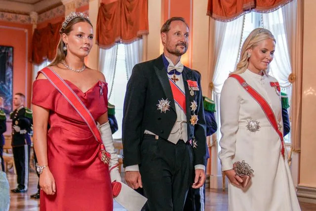 STIAN LYSBERG SOLUM/NTB/POOL/AFP via Getty Princess Ingrid Alexandra, Crown Prince Haakon and Crown Princess Mette-Marit of Norway on June 23, 2025