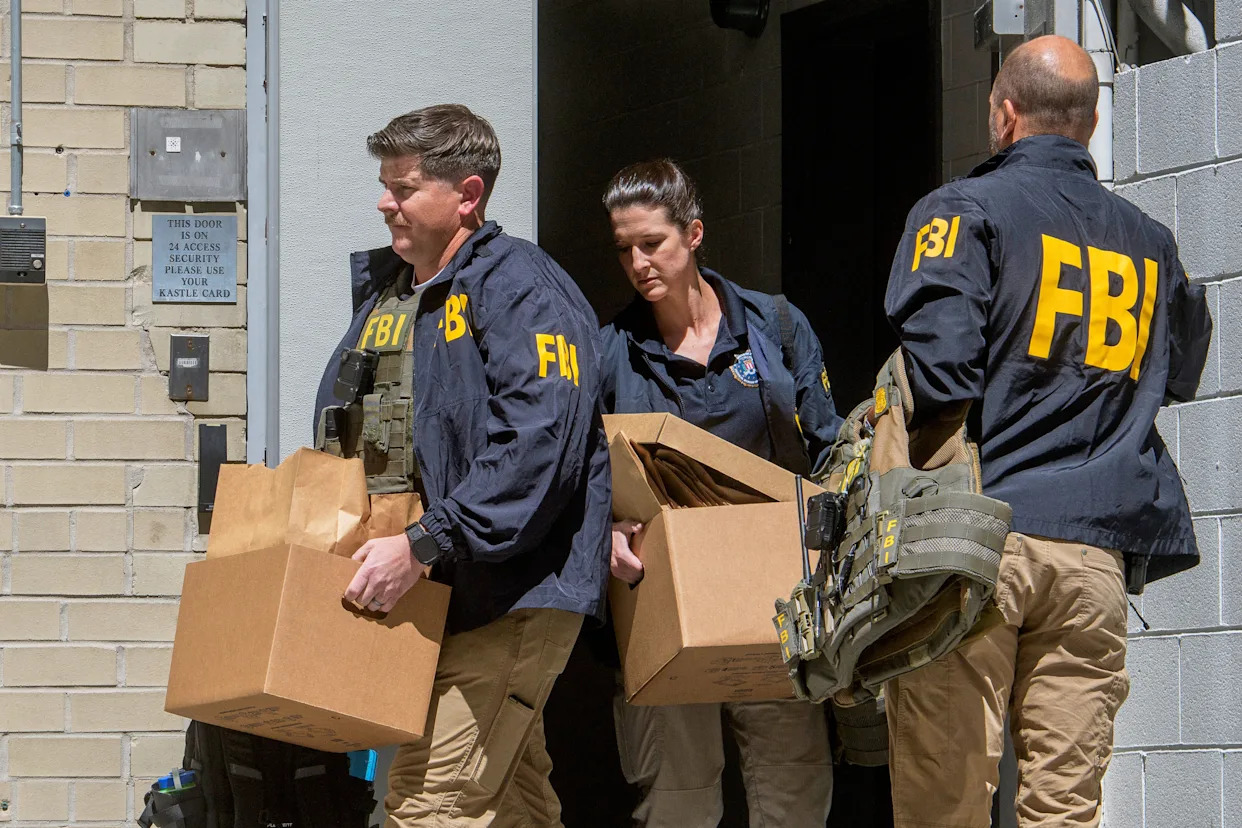 Photos of FBI searching the home and office of John Bolton, a former Trump adviser turned critic
