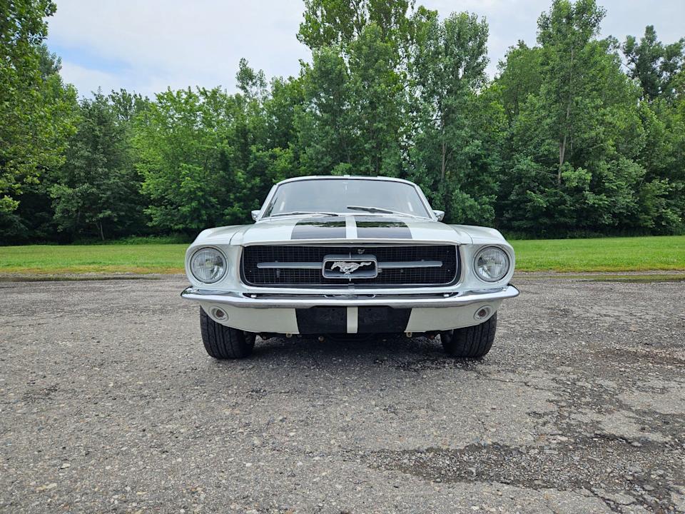 ecd automotive design 1967 ford mustang ghost restomod head on shot in parking lot