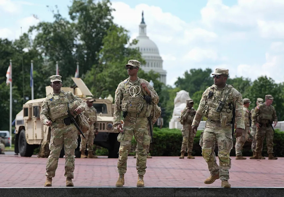Members of the National Guard stand outside Union Station on August 14, 2025 in Washington, DC. President Donald Trump announced plans to deploy federal officers and the National Guard to the District and also placed the DC Metropolitan Police Department under federal control.