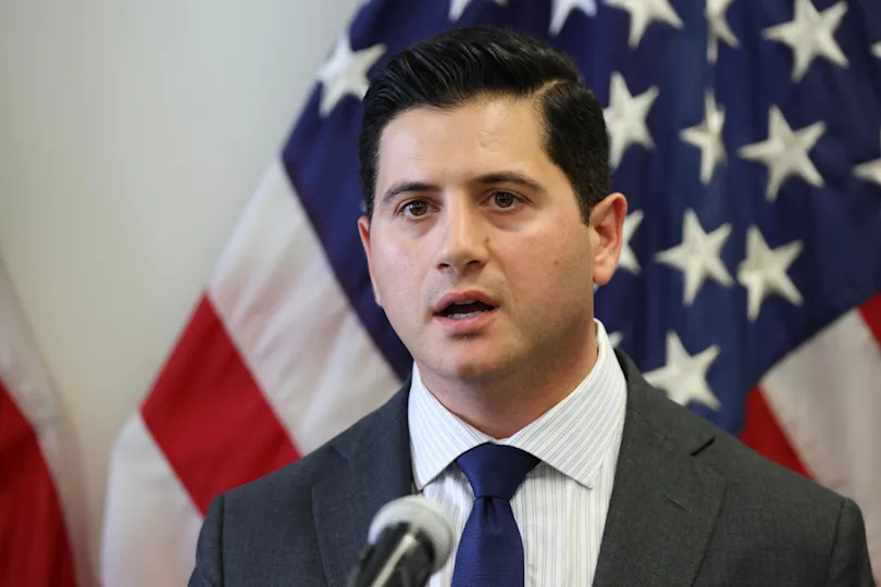 File: US Attorney for Central District of California Bilal Essayli, speaks at news conference in Los Angeles on June 12, 2025.  / Credit: PATRICK T. FALLON/AFP via Getty Images