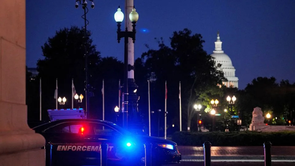 A law enforcement vehicle stands in front of Union Station near the US Capitol in Washington, DC, on Monday. - Ken Cedeno/Reuters