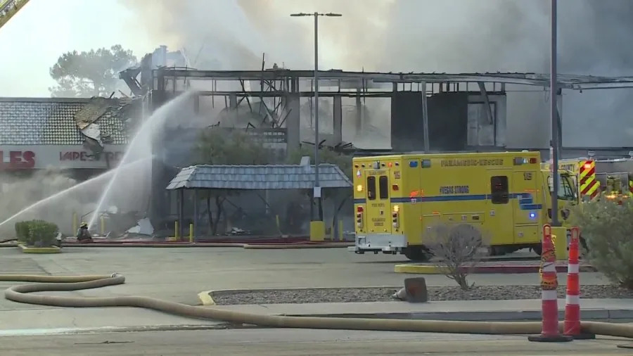 Clark County fire crews battle a large blaze at a business complex across the street from the UNLV campus on Maryland Parkway, near Tropicana Avenue on July 25, 2025. (KLAS)