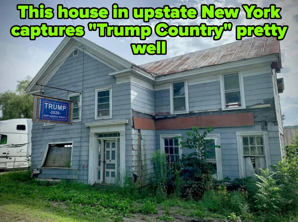 Dilapidated two-story house with a "Trump 2024" sign hanging outside. Weathered siding and overgrown vegetation surround the building