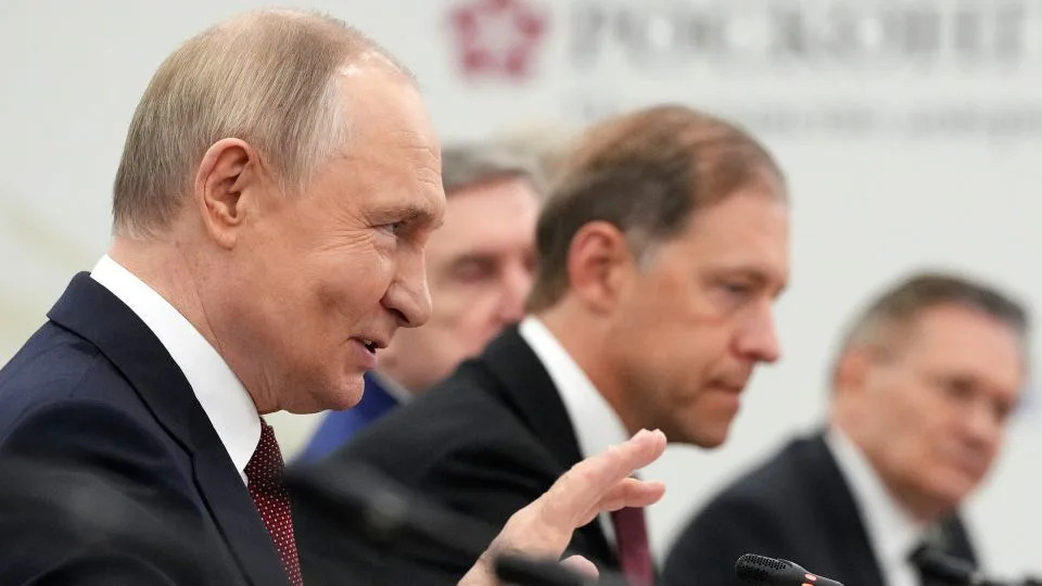 Russian President Vladimir Putin speaks on the sidelines of the St. Petersburg International Econimic Forum in St. Petersburg, Russia, on June 20. - Dmitri Lovetsky/Pool/AP