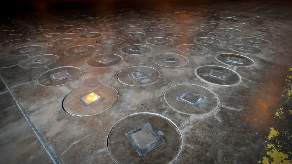 Radioactive waste sealed in large stainless steel canisters is stored under five feet of concrete in a storage building at the Savannah River Site, near Aiken, South Carolina, on November 20, 2013. - Stephen B. Morton/AP/File