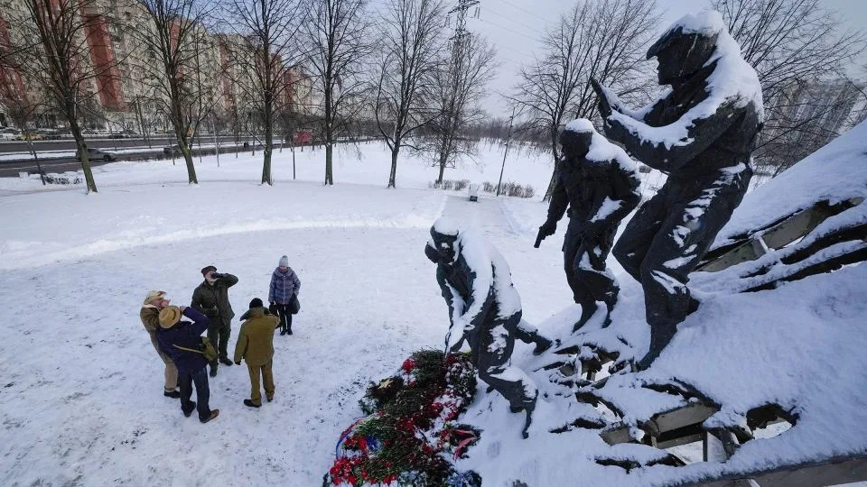 Veterans of the 10-year Soviet war in Afghanistan drink vodka in remembrance of their killed friends, after a memorial ceremony marking 36 year anniversary of withdrawal of Soviet troops from Afghanistan, in St. Petersburg on February 15. - Dmitri Lovetsky/AP