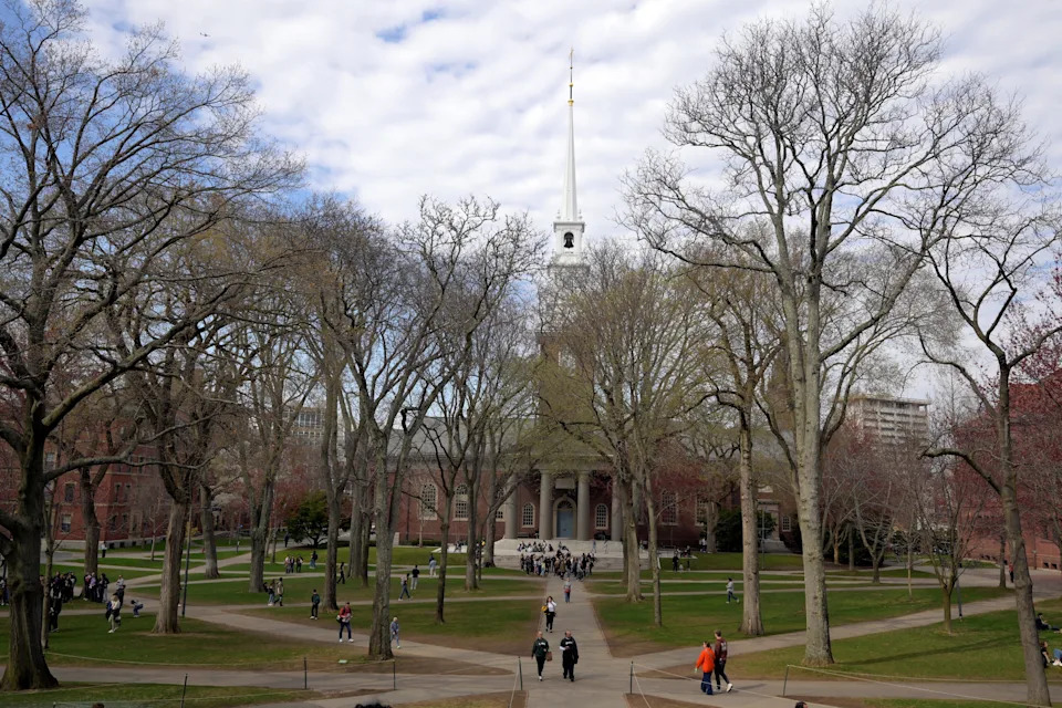 Students walk at the campus of Harvard University in Cambridge, Massachusetts on April 15, 2025.